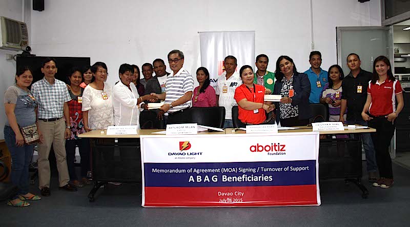 EMPOWERING COOPERATIVES. Davao Light Chief Operating Officer Art Milan and Aboitiz Foundation Manager for Enterprise Development & Microfinance Jennifer Sabianan in one of the MOA signings for loan agreements conducted over the months of June and July this year.