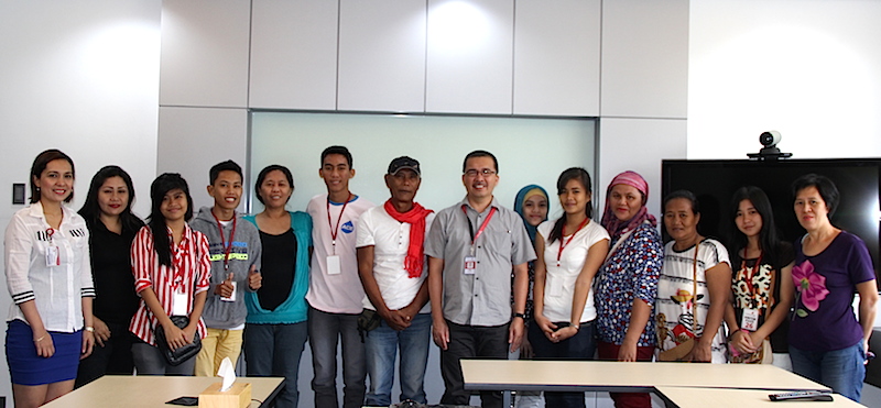 Cotabato Light AVP and Resident Manager Judy C. Sanchez (center) signed the college scholarship grant MOA with the new scholars and their parents and guardians.