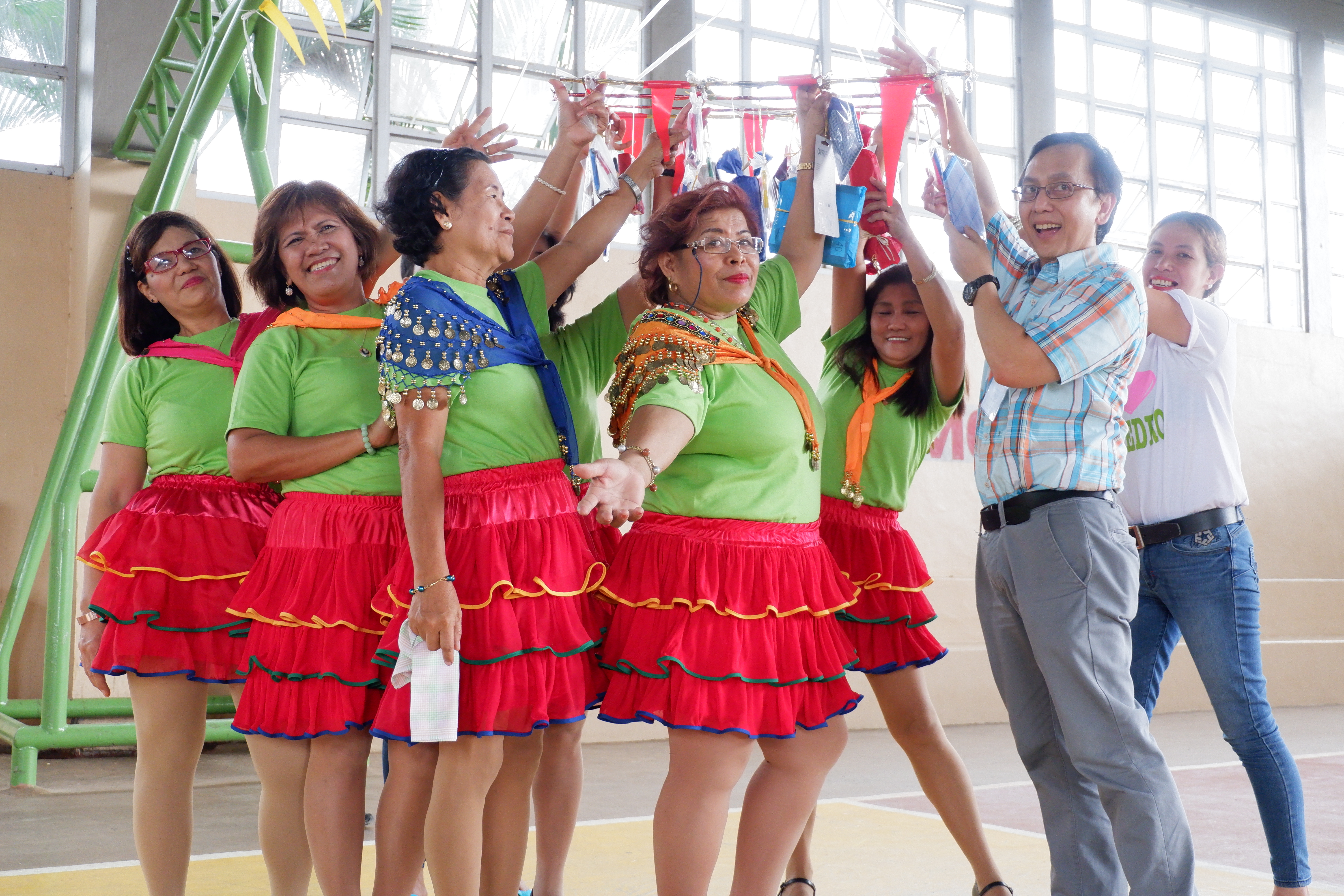 APRI President and COO Felino Bernardo enjoys a light moment with the local folks during a dance performance