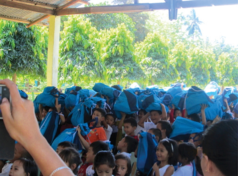 ALL IN THE BAG. Students excited with their new health kits they can call their own.