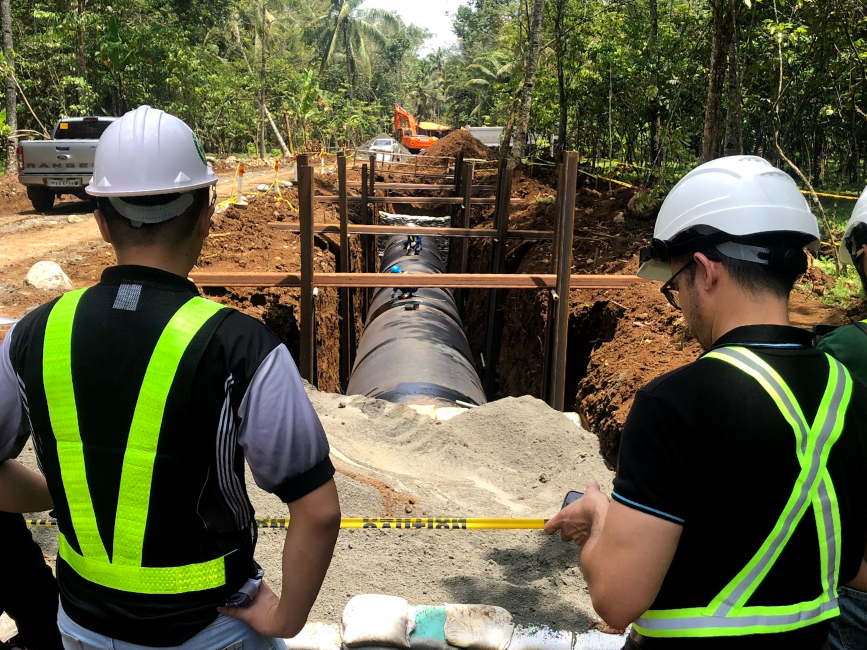 PENSTOCK - Penstock pipe-laying is ongoing and includes welding of pipe lengths and leak testing.