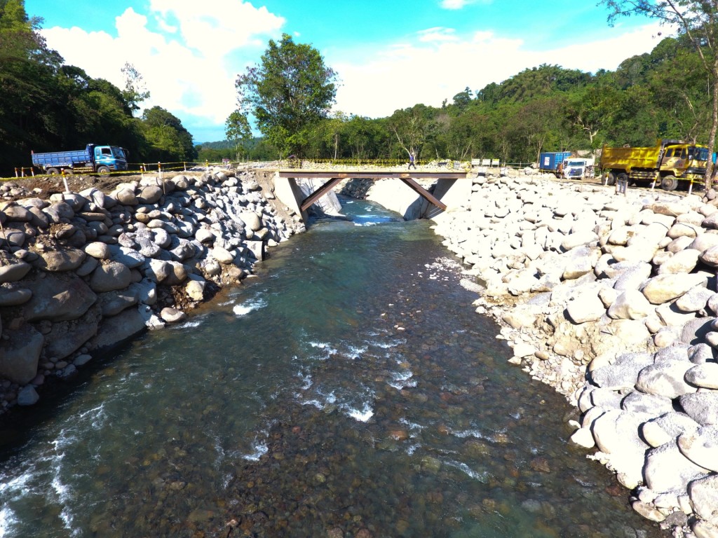 WEIR - The river flow is diverted to a temporary channel (in photo) to allow for the construction of the weir along the Tamugan River, the project’s water source.