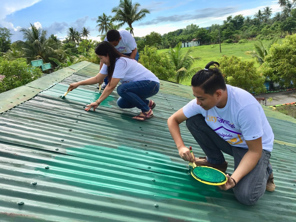 BRIGADA ESKWELA IN ACTION: Employee volunteers from CitySavings Calapan, Oriental Mindoro in action as they helped prepare Ceriaco Abes Memorial National High School in Calapan City for the opening of classes.