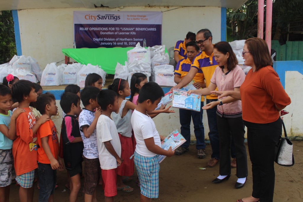 STRONG COMMITMENT TO EDUCATION: Students from various schools in Northern Samar which were affected by Tropical Depression Usman receives learning kits from CitySavings led by its Catarman Branch.