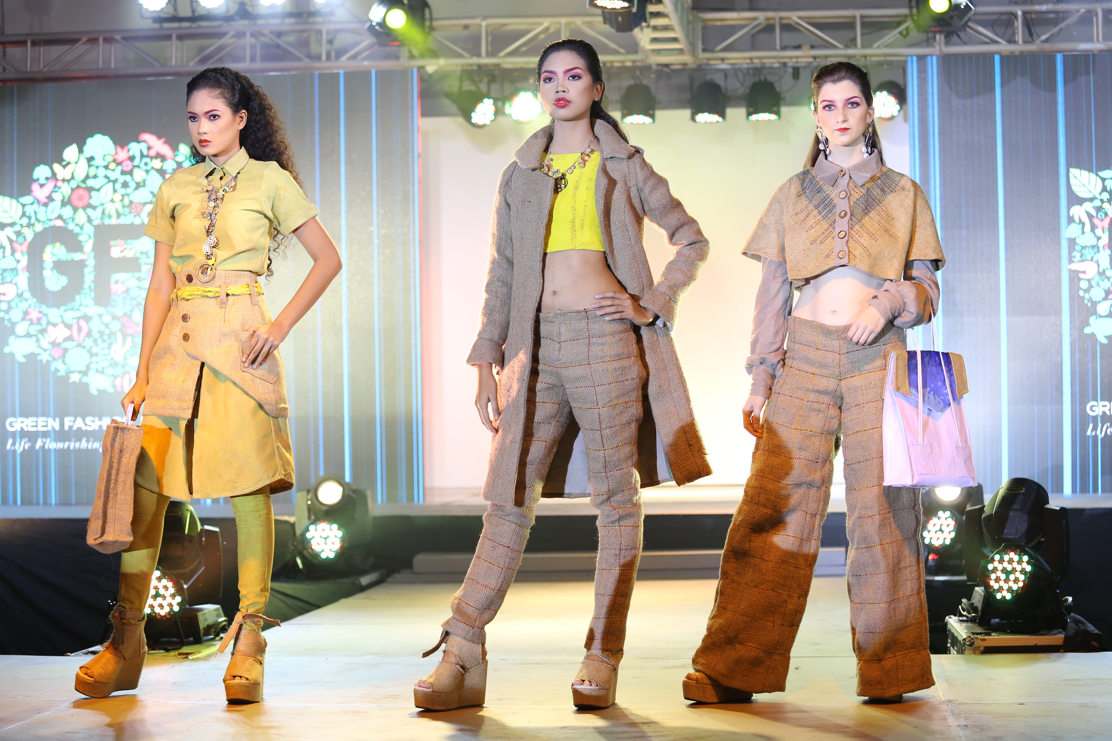 Majority of FIDA's pieces were made from burlap sacks taken from coffee shops. They were lined with flour sacks to make them comfortable. The pieces were dyed naturally using coffee grounds (for browns) and turmeric (for yellows). The process included stripping the plastic from the tarpaulins, leaving a semi-sheer fibrous framework to structure the overall look. The removed plastic was used to stuff their chunky coat introduced in the finale. The shoe soles were created by layering used cork board. FIDA also won the special awards Best in Clothing Design, Best in Accessories Design, Best Bag Design, and Best Footwear Design. FIDA's Lawrence and Daina won the Best Male Model and Female Model, respectively. FIDA gets P50,000 in cash prize and another P50,000 allocated for its CSR project with Aboitiz Foundation.