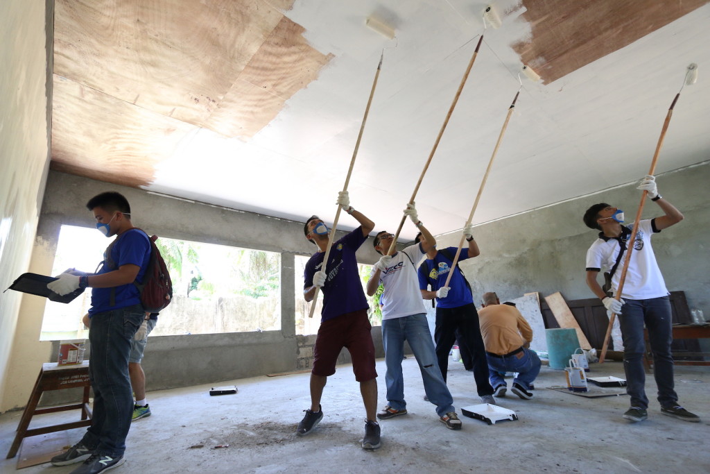 NOT SO SIMPLE. Mark John was among those who painted classroom ceilings, a task which may look simple from afar, but is actually quite an exhausting task.