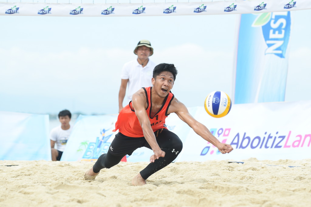 BEACH DIG. Player from Team Malaysia digs a hard hit ball to keep the play alive.