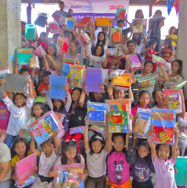 READY TO LEARN. Otucan kids receive school supplies from Hedcor.