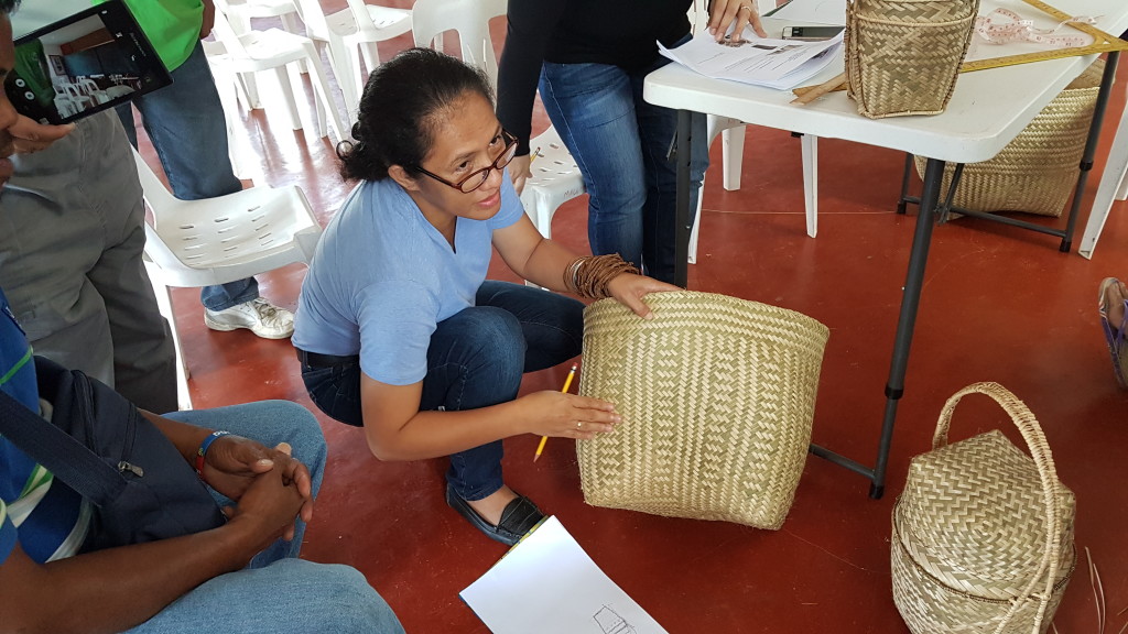 KNOWLEDGE SHARING. Juvey Fernandez of TADECO Home gives local basket weavers some tips on how to improve the quality of their crafts.