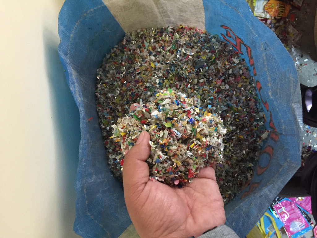 The shredded plastic is used as a component in making the bricks for footpath and plant bricks.