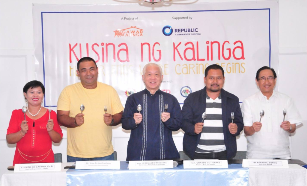 Ready to feed schoolchildren and nourish dreams are (from right): Republic Cement & Building Materials, Inc. President Renato Sunico; Taysan Mayor Grande Gutierrez; Batangas Governor Hermilando Mandanas; GK Movement Building Head Jose Emilio Oquinena; and Taysan Central School principal Belinda Arellano.