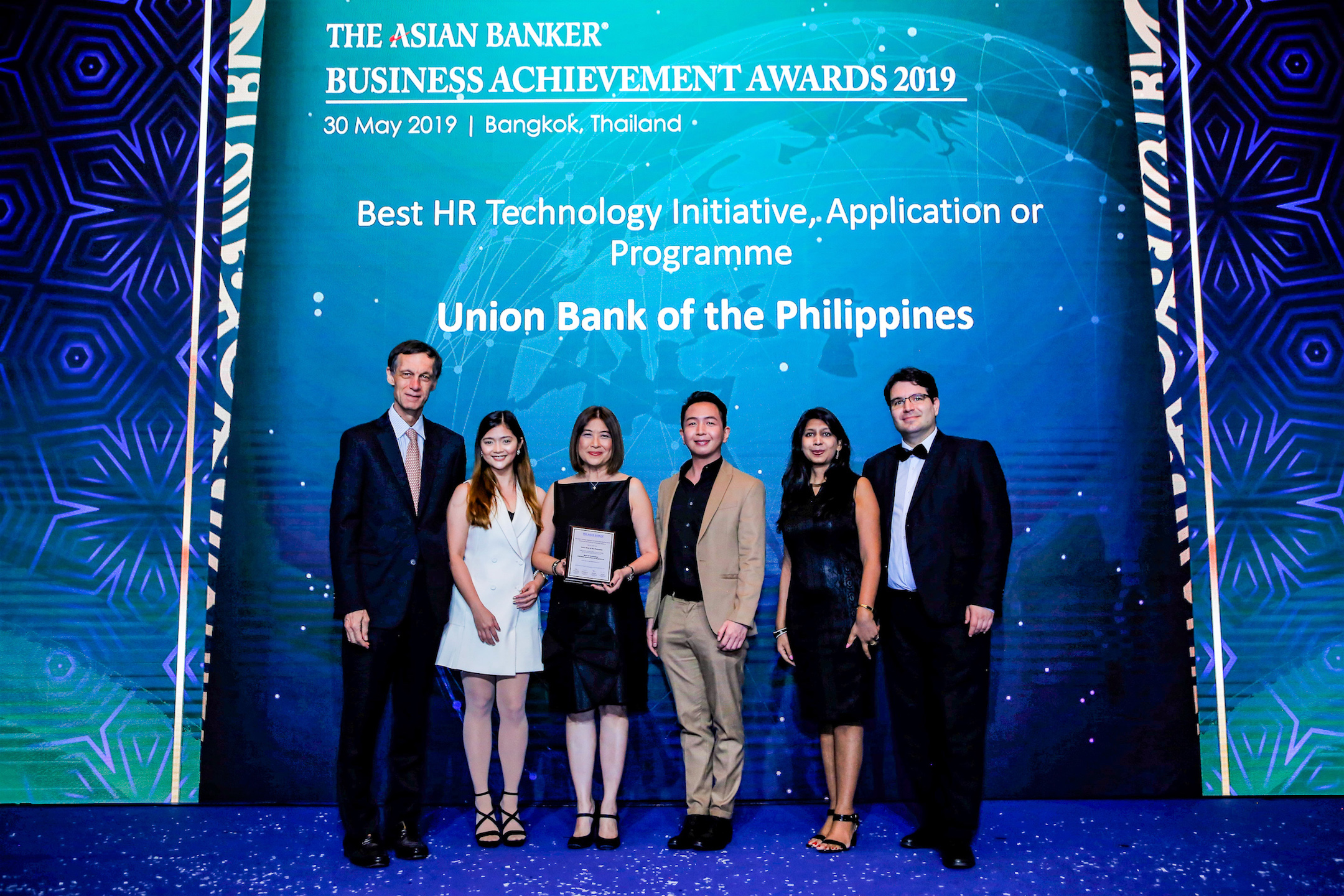 BEST USE OF TECH IN HR. UnionBank HR Director Michelle Rubio (third from left), together with Employee Experience Head Alexander Ang II and Employee Experience Manager Zheanne Davis, receive the Bank’s award from The Asian Banker International Resource Director David Gyori, senior researcher Neeti Aggarwal and International Resource Director Richard Hartung during the awarding ceremony in Bangkok last May 30.