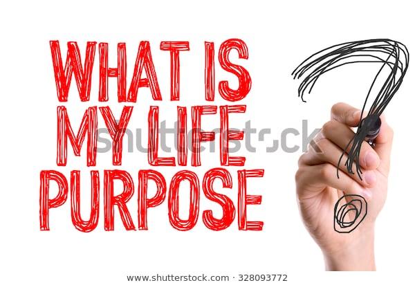 Hand with marker writing: What is My Life Purpose?